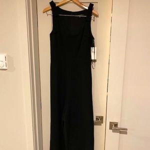 Black wide leg jumpsuit with bows on each shoulder